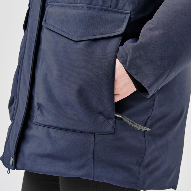 A navy Women's Denali Parka featuring a zip and button closure, with large pockets on the front and a slim fit.