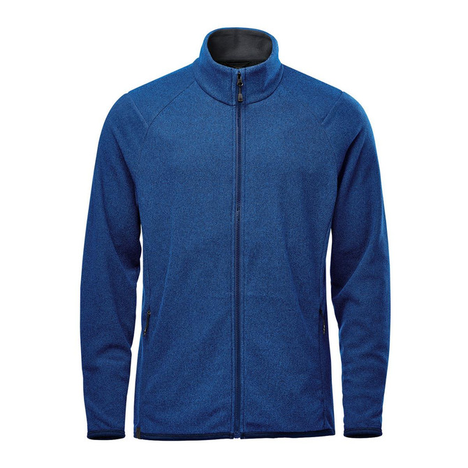 A blue full zip jacket featuring a high collar and zippered pockets, with a subtle branded logo.