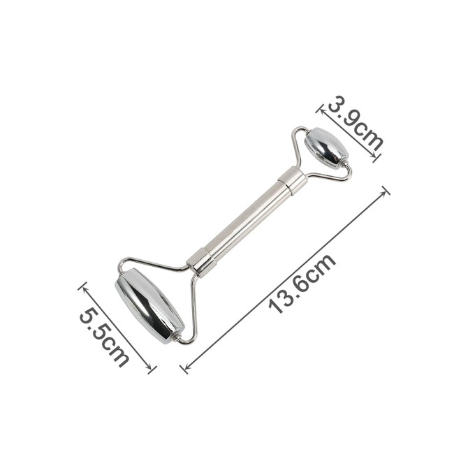 A stainless steel facial roller with two rounded ends, measuring 13.6 cm in length, on a white background.
