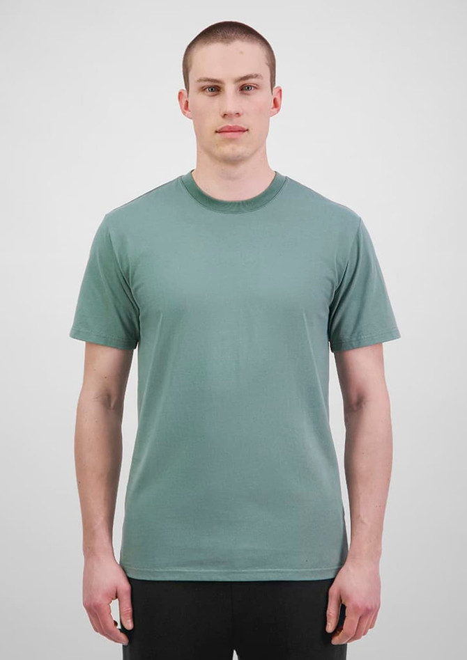 A green short sleeve tee displayed on a male model against a neutral background, featuring a logo.