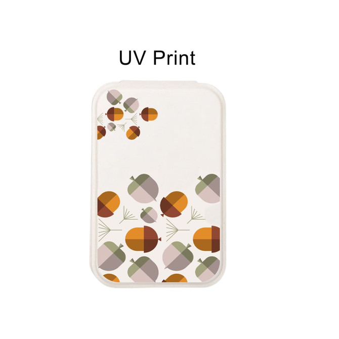 A portable mini mirror in various earthy tones featuring a graphic design of acorns. It has a logo on the front.