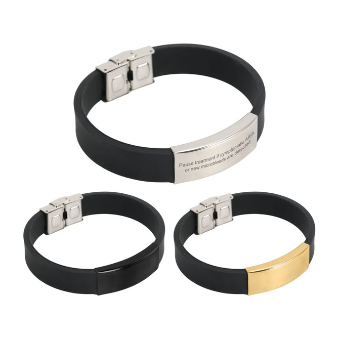 Three bracelets featuring engraved stainless steel buckle latches, with black silicone bands; one has a gold accent.