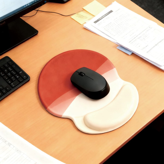 A lightweight gel mouse mat featuring a red and cream design, with a black mouse resting on it.