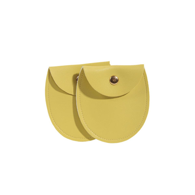 Two oval yellow PU leather jewelry pouches with snap closures, featuring a smooth finish.