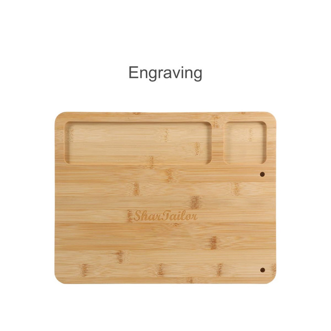 A bamboo cheese board with two compartments, featuring an engraving and a smooth wooden surface.
