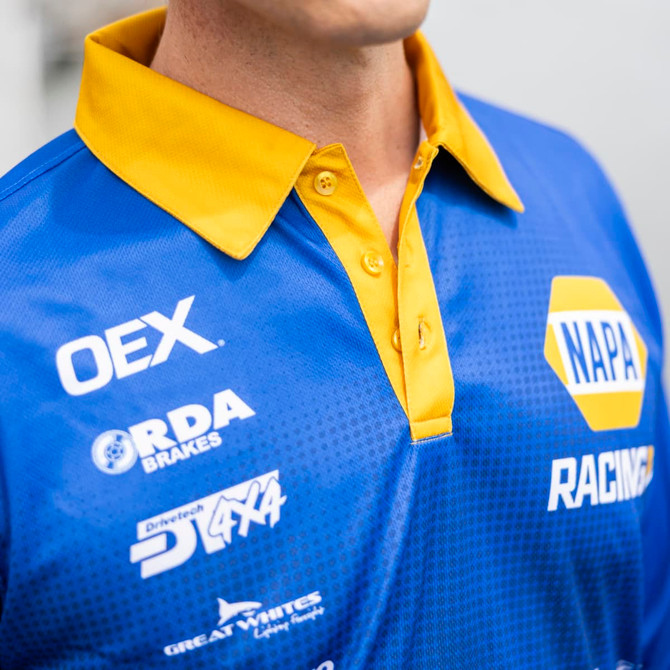 A blue and yellow men's long sleeve fishing polo featuring a collar, buttons, and a logo.