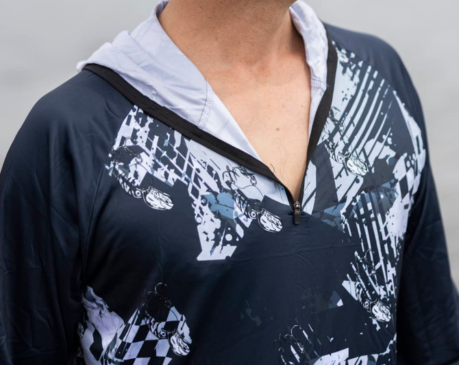 A 1/4 zip fishing hoodie in navy with a striking graphic design, featuring a hoodie and a branding logo.