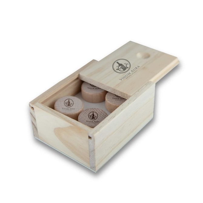 A wooden box containing several classical wood wine stoppers, featuring a logo on the lid.