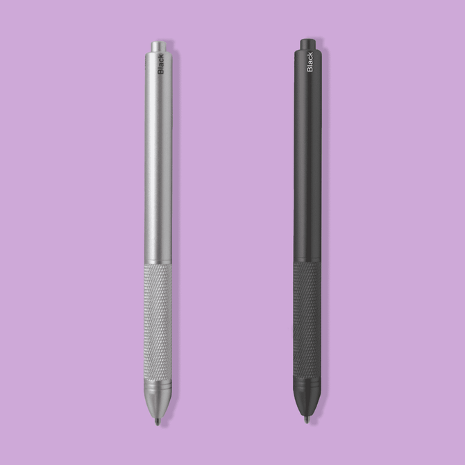 A metal pen set featuring a silver pen and a black pen with textured grips. Both pens have a branding logo.