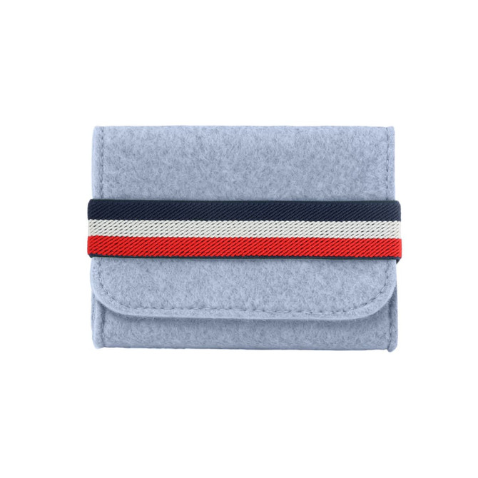 A grey felt essential oils travel organiser with a striped elastic band in navy, red, and white.