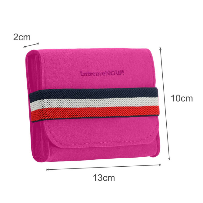 A pink felt travel organiser with a striped elastic band, featuring a compact design measuring 13cm by 10cm.