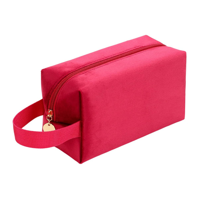 A pink flannel cosmetic bag with a zip closure and a handle, featuring a subtle logo.