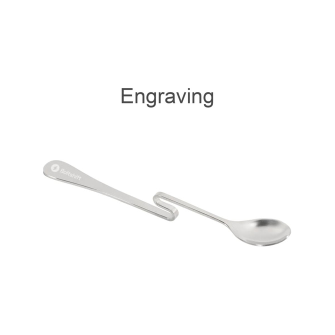 A silver spoon with a unique hanging design, featuring a logo on the handle.