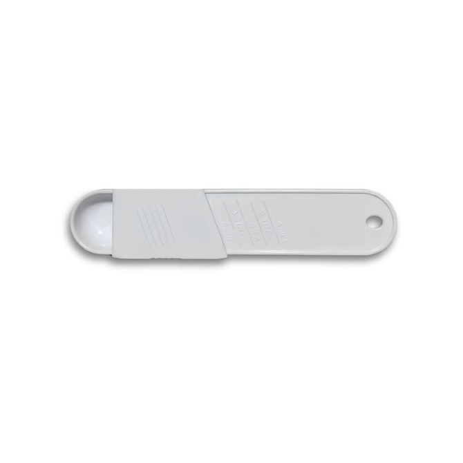 A white measuring scoop with a rounded end and a flat handle, featuring measurement markings and a logo.