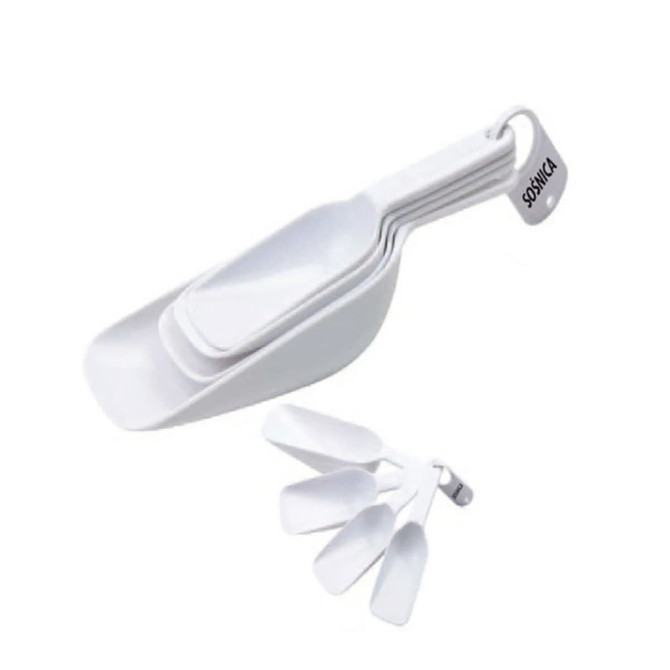A set of white measuring scoops, featuring multiple sizes, with a loop for easy storage. It has a logo.