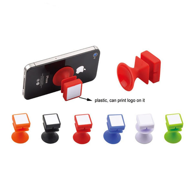 A collection of plastic mobile stands in red, orange, black, blue, white, and green, designed to hold phones.