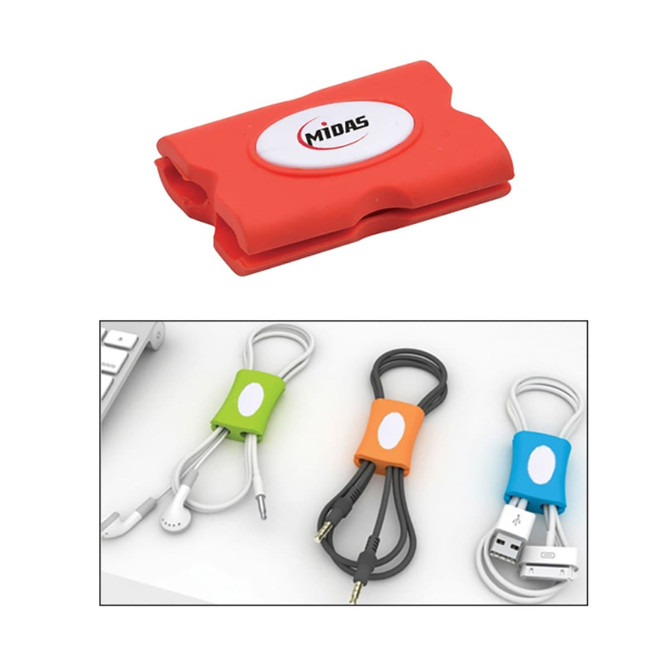 A red cable organiser with a logo and three tidied cables in green, orange, and black.