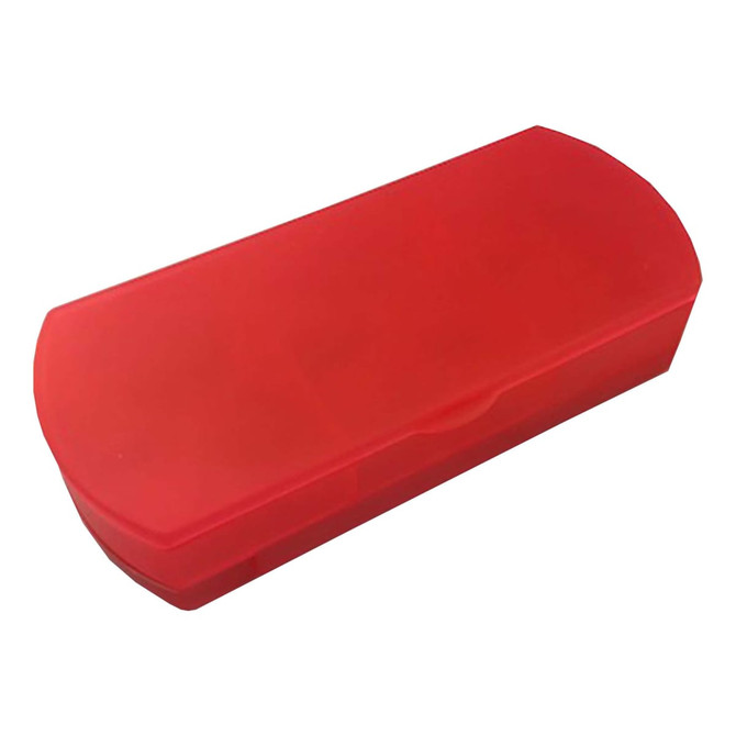A red travel pill box with a hinged lid, designed for organising medications. Features a logo on the surface.