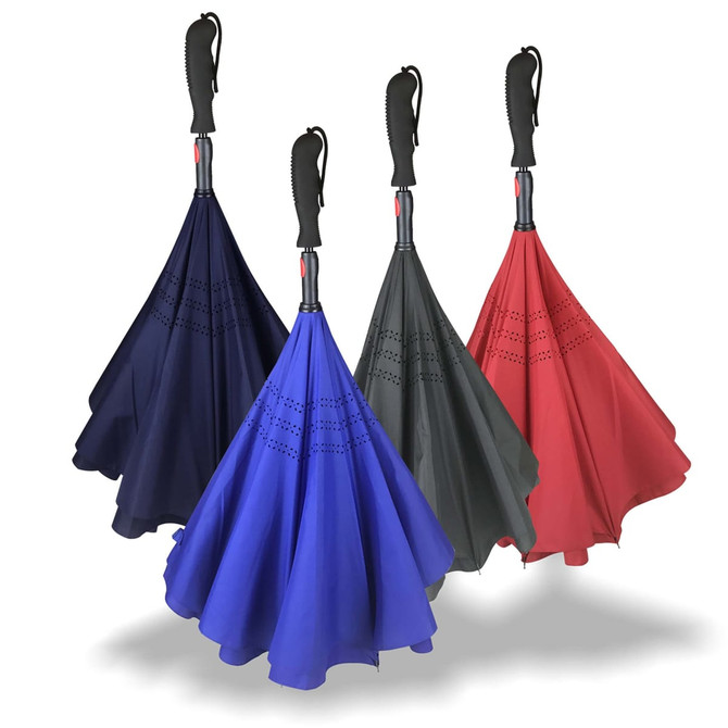 Four inverted umbrellas in navy, blue, dark green, and red with black handles, featuring a design on the canopy.
