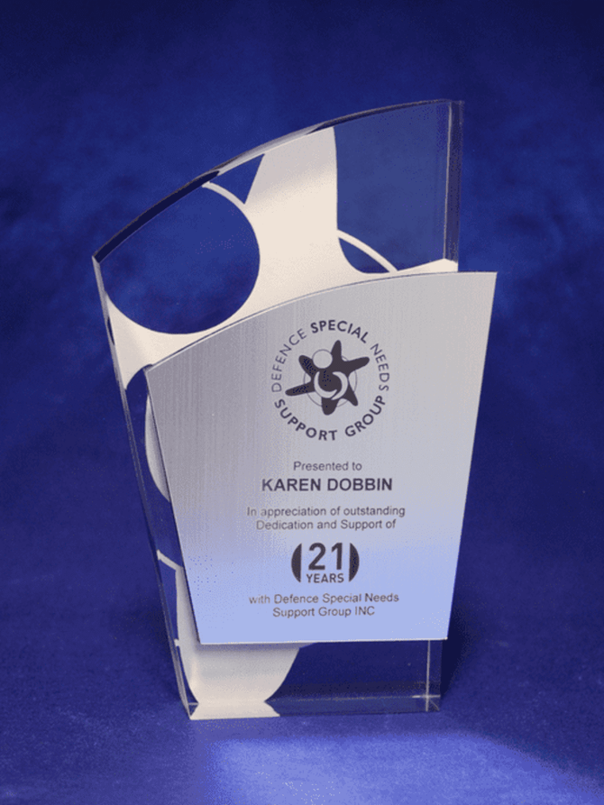 A contemporary acrylic trophy featuring a metallic facia and laser engraving, with a blue background. It has a logo.