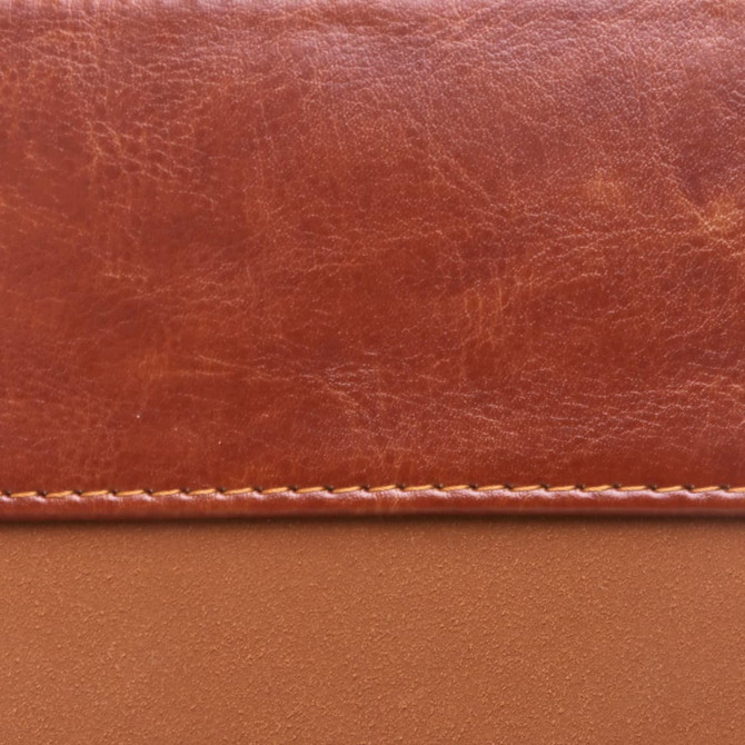 A brown RFID PU leather passport holder with a textured finish and stitched detailing. Features a logo.
