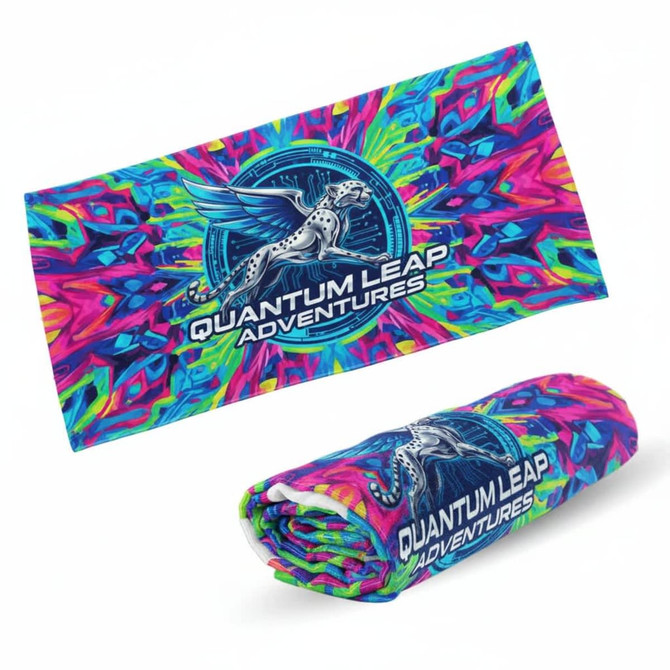 A vibrant beach towel in shades of pink, blue, and green, featuring a logo and a rolled-up version.