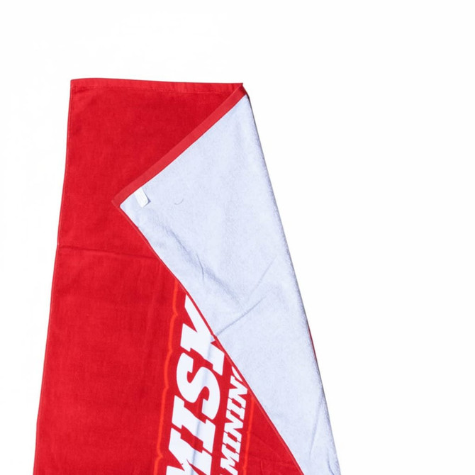 A red and white beach towel made from cotton, measuring 75cm x 150cm, featuring a logo.