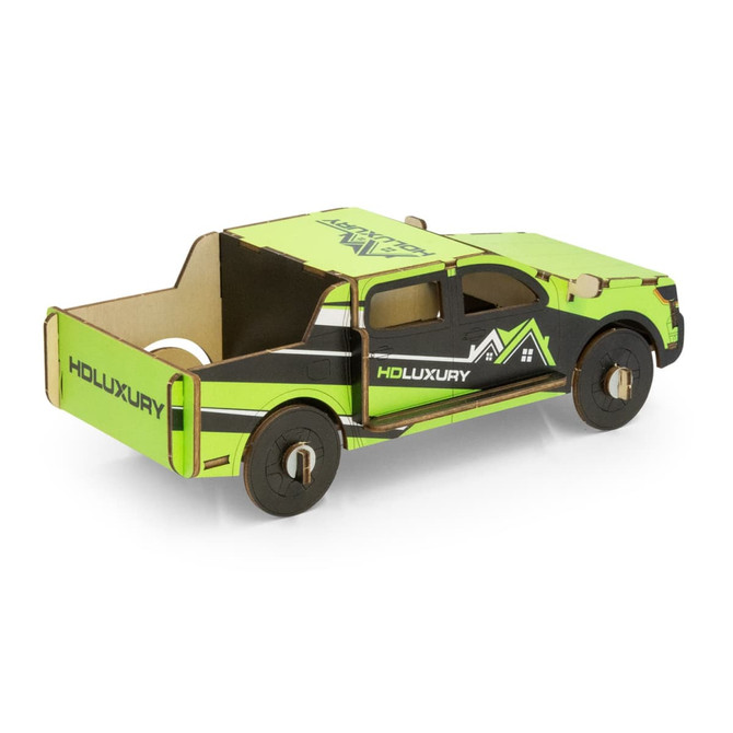 A green and black wooden model of a UTE, featuring detailed designs and a logo. Ideal novelty item for fun and games.