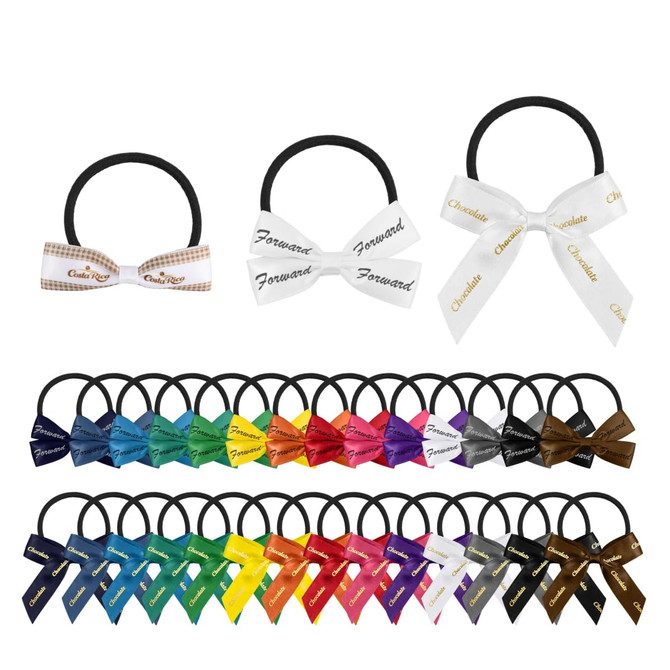 Elastic hair bows in various colours, including black, white, blue, and brown, displayed on black hair ties.