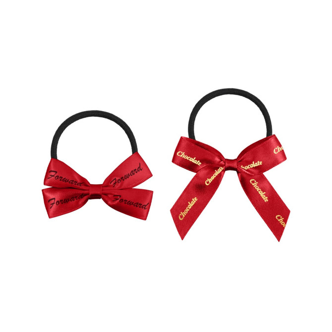 Two elastic hair bows in red, one with a double bow design and the other with a single bow design featuring branding.