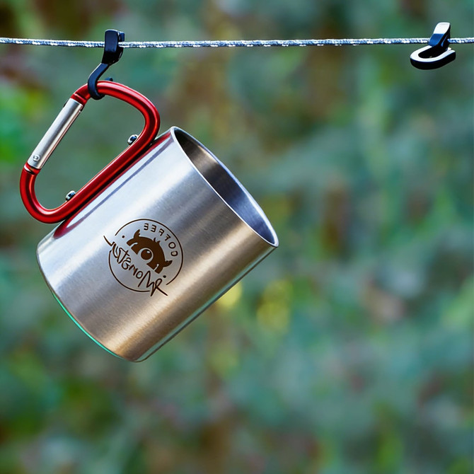 A stainless steel insulated travel mug in silver with a red carabiner handle, featuring a logo.