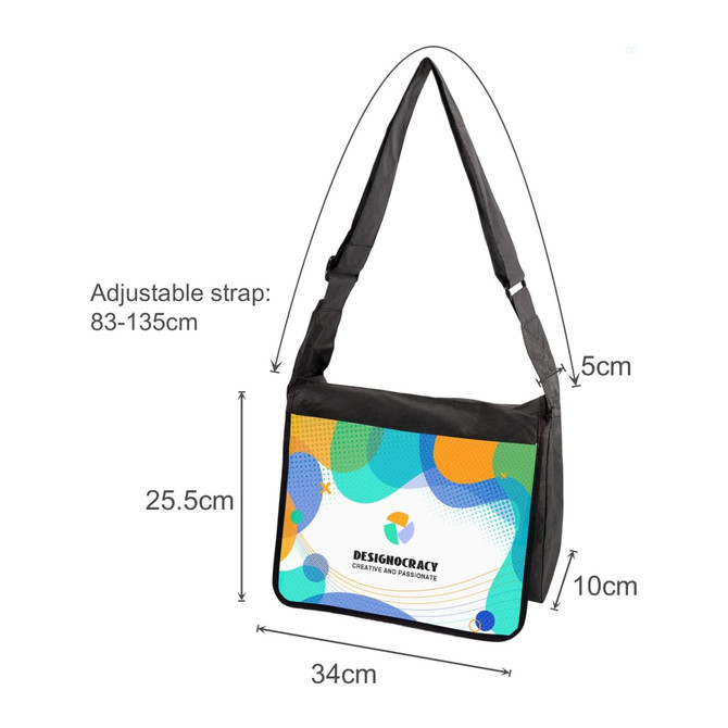 A full colour messenger bag in vibrant blue, green, and yellow, with an adjustable black strap and a logo.