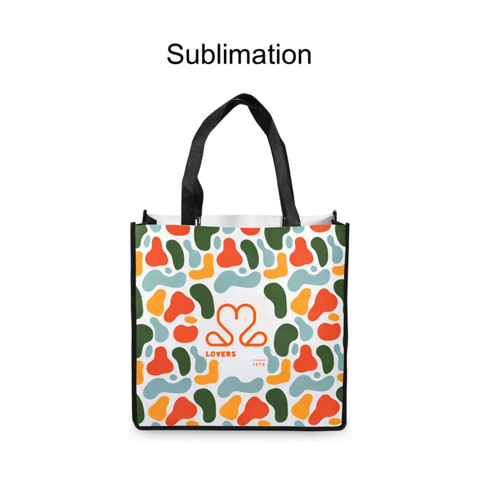 A vibrant tote bag featuring an abstract pattern in green, orange, and blue, with black handles and a logo.