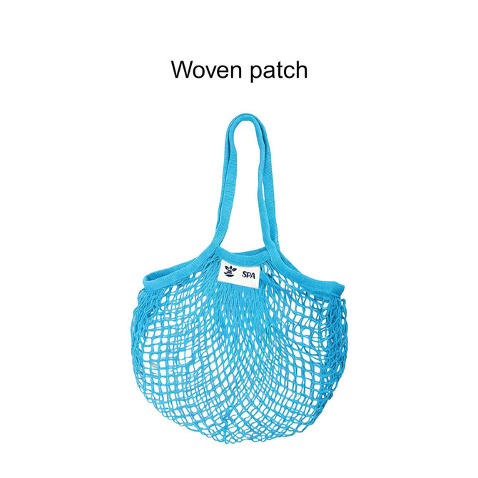 A blue mesh grocery bag with two handles and a woven patch. It has an open design for easy storage.