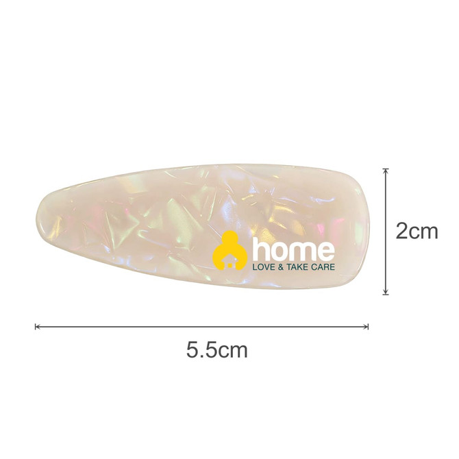 A translucent acetate hair alligator clip in a pearlescent finish, featuring a logo. Dimensions are 5.5 cm by 2 cm.