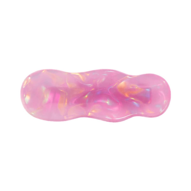 An iridescent pink alligator hair clip with a wavy design, featuring a shiny, reflective surface.