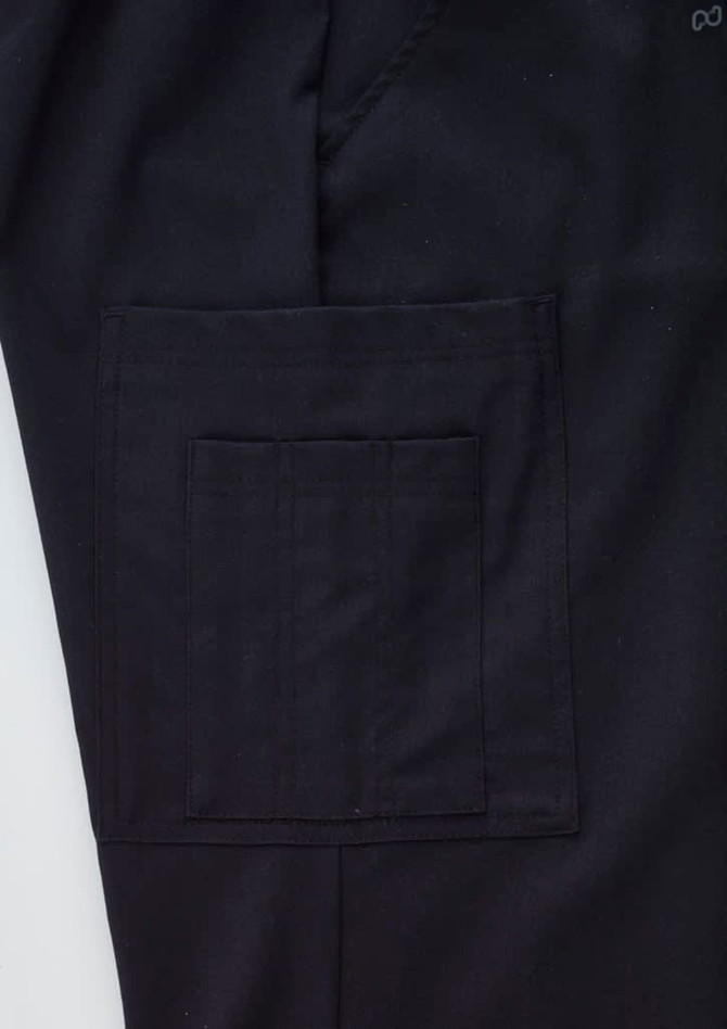 A close-up of black cargo pants featuring a large side pocket and a subtle logo on the waistband.