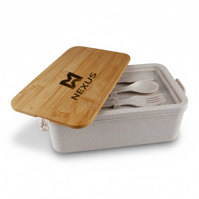 A bamboo lunch box with a light-coloured base and a bamboo lid, containing utensils inside. Contains a logo.