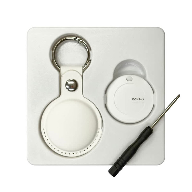 A white tracking tag and keyring, accompanied by a small screwdriver, displayed on a white background.