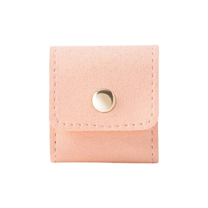 A pink mini synthetic leather jewellery bag with a snap closure and stitching detail. It features a small logo.