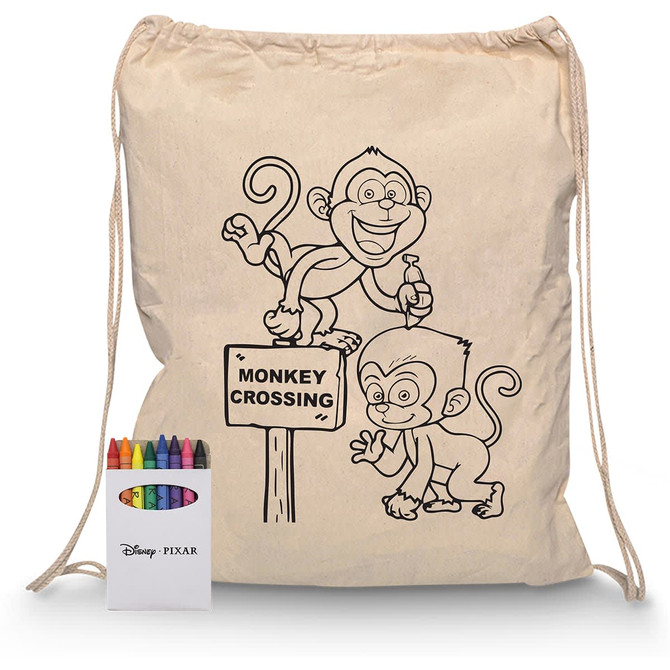 A beige drawstring bag featuring monkey illustrations and a crayon set with multiple colours.