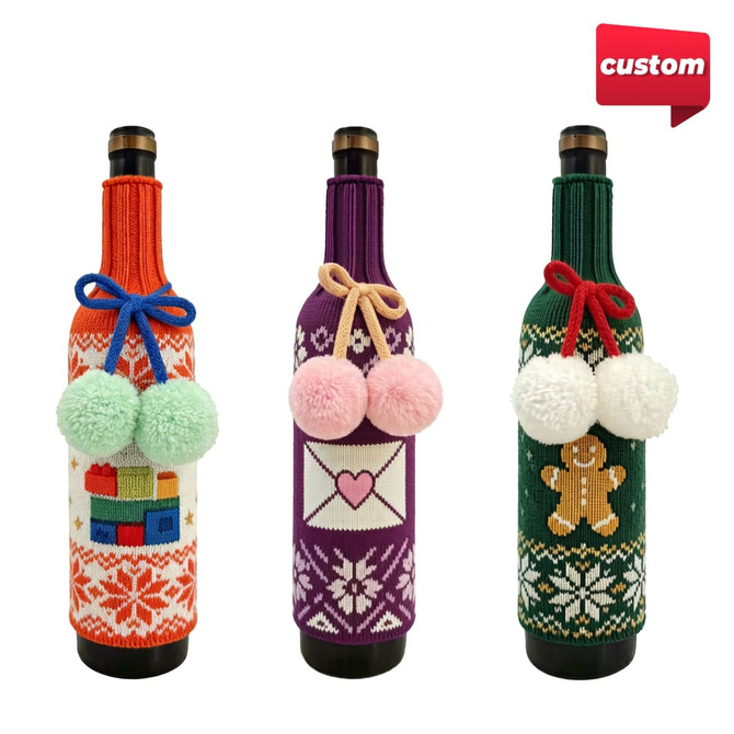 A drink bottle sleeve trio in festive designs, featuring red, purple, and green knitted patterns with pom-poms.