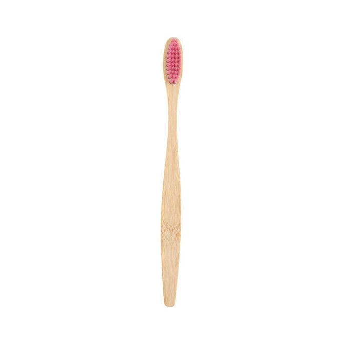 A large bamboo toothbrush with a pink bristle head and a smooth, natural bamboo handle.