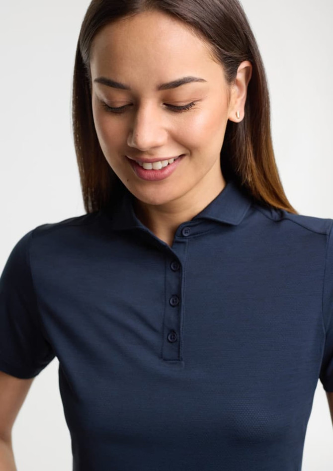 A navy women's short sleeve polo shirt with a collar and button placket, featuring a branding logo.