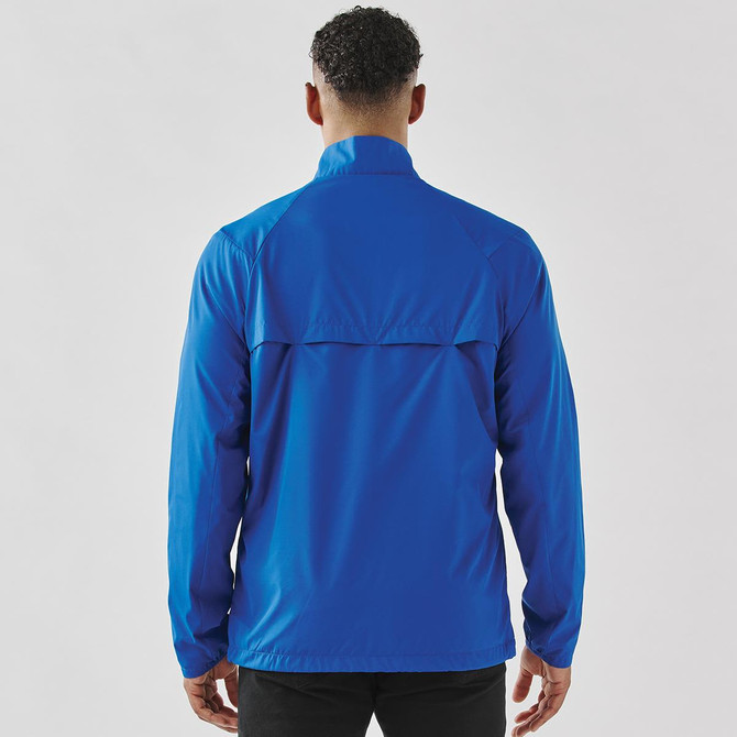 A blue men's full zip rain jacket with a back vent and a logo on the upper section.
