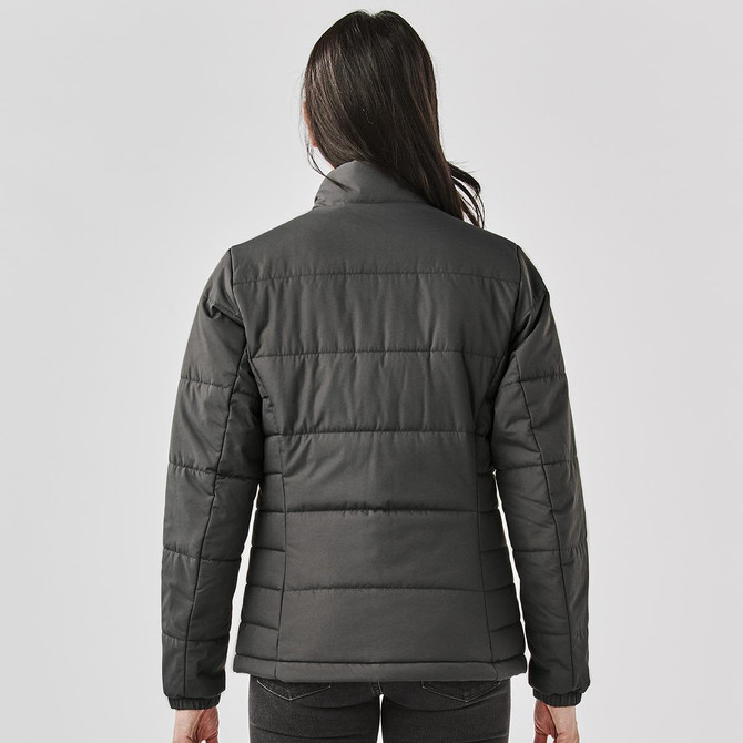 A women's puffer jacket in dark grey, featuring a quilted design and a high collar. It includes a logo on the back.