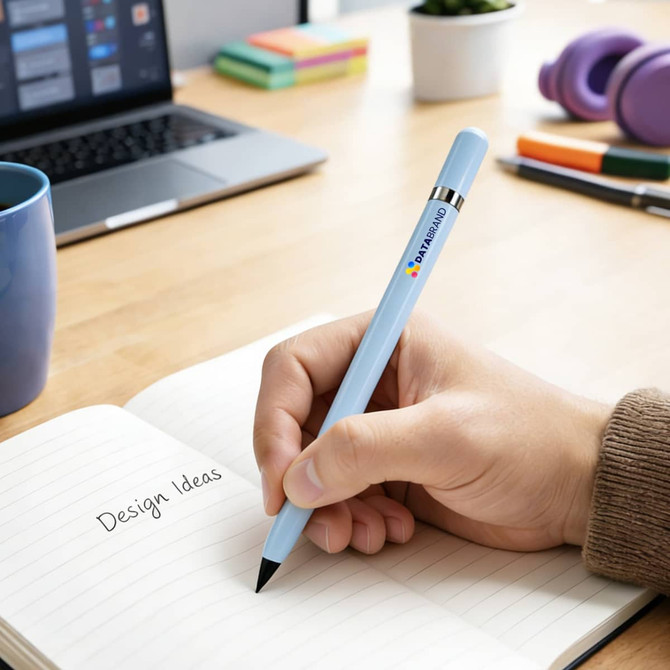 A light blue pencil is held over a notebook with "Design Ideas" written on it, alongside a laptop and stationery items.