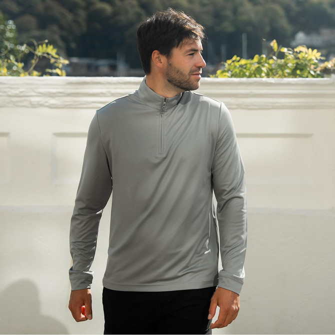 A grey men's pullover with a quarter zip, featuring long sleeves and a logo on the side.