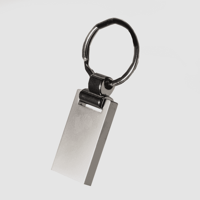 A silver keychain with a rectangular pendant and a circular ring, featuring a simple, sleek design.