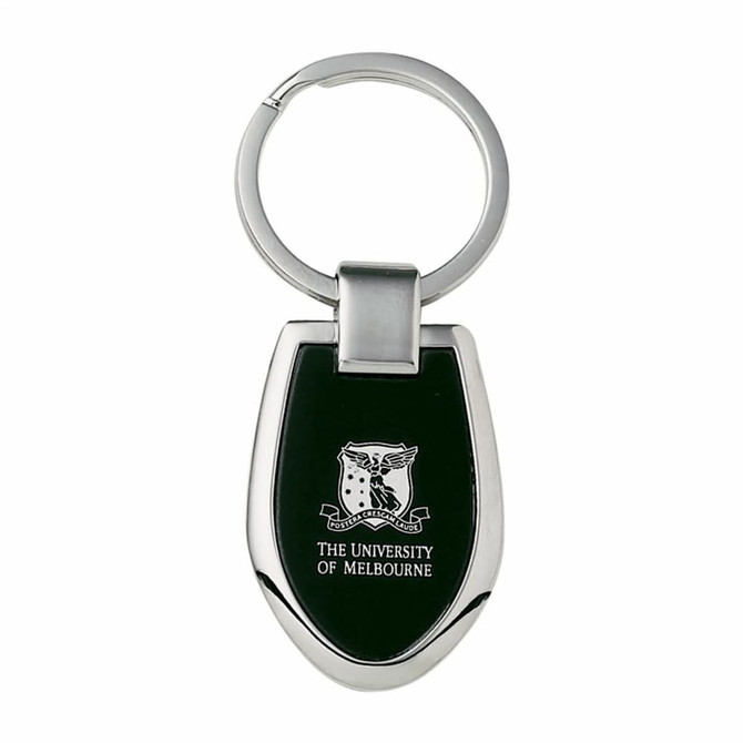A keychain with a silver metal finish and a black shield-shaped pendant featuring a logo.
